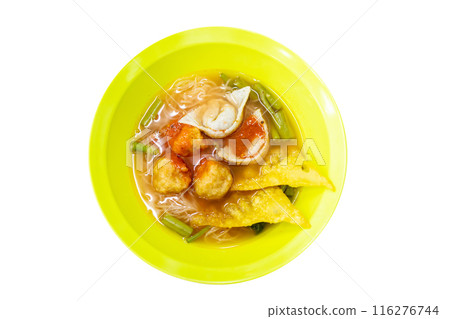 Top view of Thai Style Noodle with assorted tofu and fish ball in Red Soup in yellow bowl, focus selective 116276744