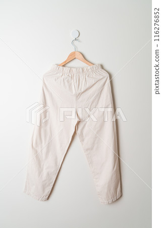trousers or long pants hanging on wall trousers or long pants hanging on wall 116276852