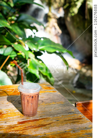 iced chocolate milkshake on table 116276888