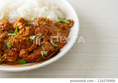 chicken tikka masala with rice on plate 116276900