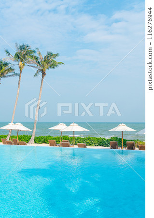 umbrella with bed pool around swimming pool with ocean sea background 116276944