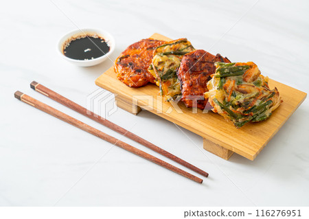 Pajeon or Korean pancake and Korean Kimchi pancake or Kimchijeon on white background Pajeon or Korean pancake and Korean Kimchi pancake or Kimchijeon on white background 116276951