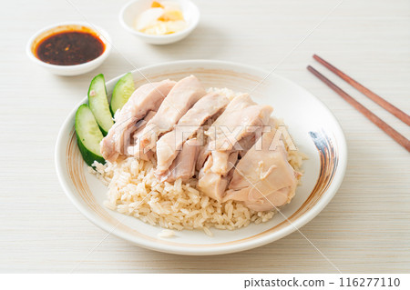 Hainanese chicken rice or rice steamed with chicken soup Hainanese chicken rice or rice steamed with chicken soup 116277110