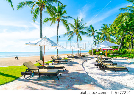 Beautiful umbrella and chair around swimming pool in hotel and resort 116277205