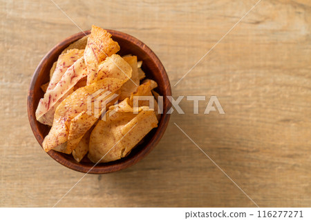 Taro Chips - fried or baked sliced taro 116277271