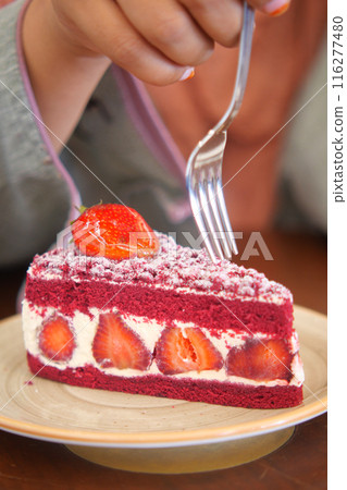 cutting Strawberry chiffon cake on a plate  116277480