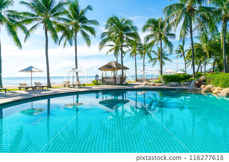 Beautiful umbrella and chair around swimming pool in hotel and resort Beautiful umbrella and chair around swimming pool in hotel and resort 116277618