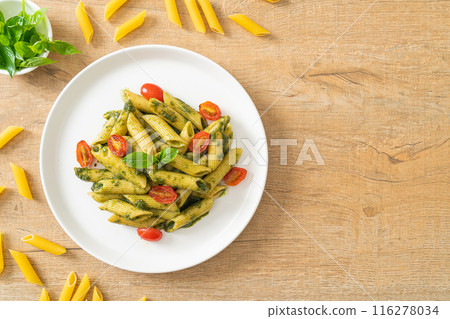 penne pasta with pesto sauce and tomatoes penne pasta with pesto sauce and tomatoes 116278034