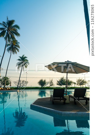 umbrella with bed pool around swimming pool with ocean sea background 116278065