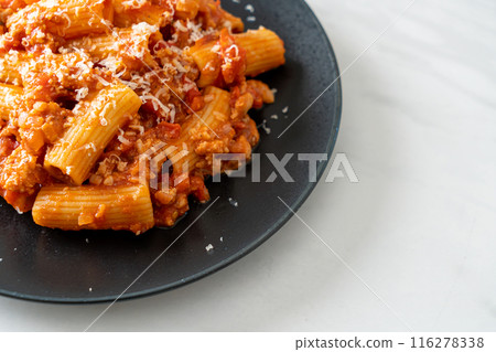 Rigatoni pasta bolognese with cheese 116278338