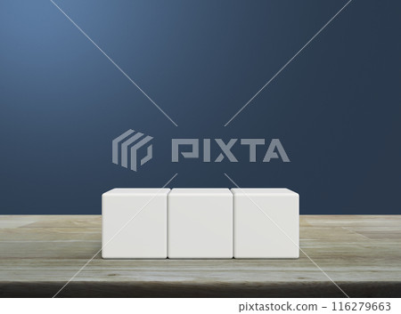 Three white block cubes on wooden table Three white block cubes on wooden table 116279663
