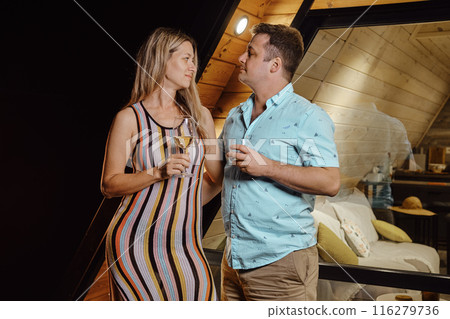 Couple in love on terrace in the evening 116279736