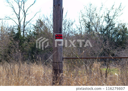 Private Property no trespassing sign on power pole  116279807