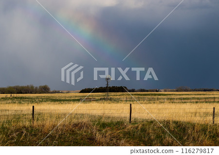 Nature Rainbow over pretty green Nebraska landscape with windmill Nature Rainbow over pretty green Nebraska landscape with windmill 116279817