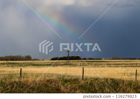 Nature Rainbow over pretty green Nebraska landscape with windmill Nature Rainbow over pretty green Nebraska landscape with windmill 116279823