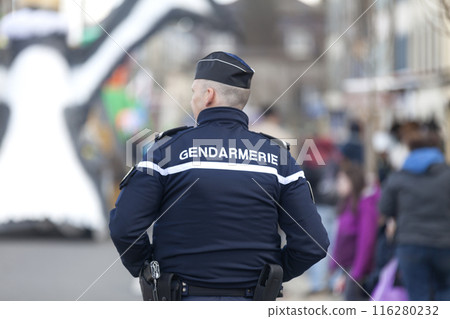 French gendarme monitoring the crowd during the carnival of Landerneau 116280232
