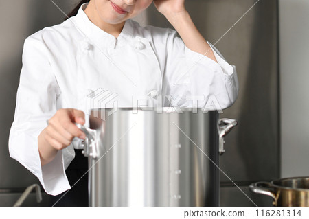 Asian female chef worried in front of a cooking pot 116281314