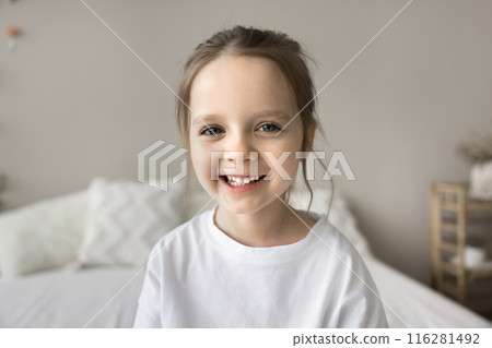 Head shot portrait of small awakened refreshed laughing child 116281492
