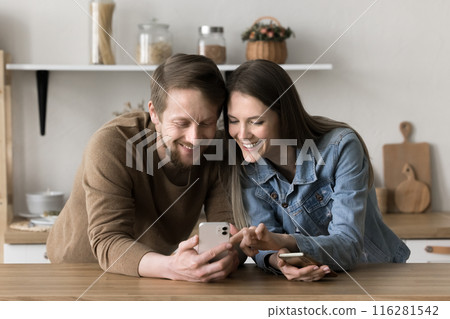 Millennial couple read news using smartphone spend pastime on internet 116281542