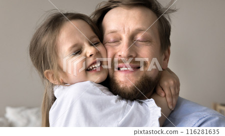 Beautiful little 3s daughter cuddling tightly her young dad 116281635