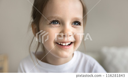 Adorable smiling little 4s baby girl looking away, closeup portrait 116281843