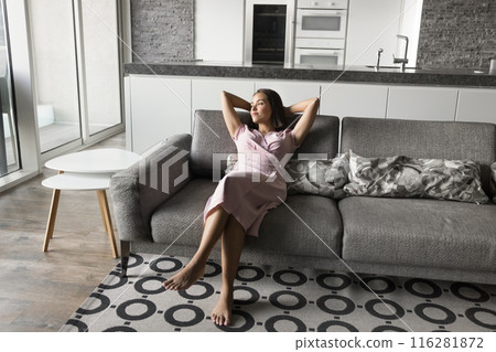 Relaxed lazy beautiful young woman resting on comfortable couch Relaxed lazy beautiful young woman resting on comfortable couch 116281872