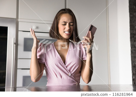 Angry frustrated young woman getting bad news Angry frustrated young woman getting bad news 116281964