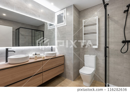 Modern bathroom with efficient lighting and contemporary fixtures, stylish and comfortable Modern bathroom with efficient lighting and contemporary fixtures, stylish and comfortable 116282636