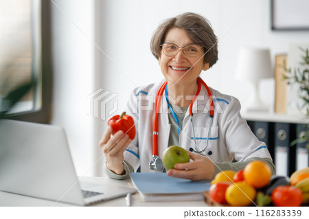 doctor is working in medicine office 116283339