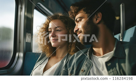 Cheerful young adult couple travelling by train, responsible travel concept 116284198
