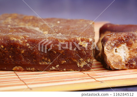 Jaggery traditional cane sugar cube on table  116284512