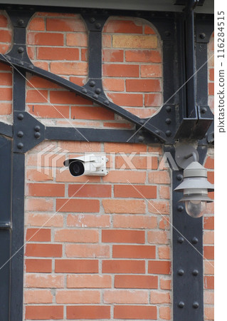 CCTV security camera operating outdoor  116284515