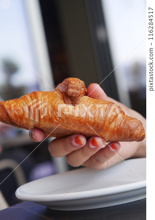 top view of hand pick fresh baked croissant top view of hand pick fresh baked croissant 116284517