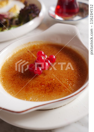 Caramel custard pudding on a plate on table Caramel custard pudding on a plate on table 116284552