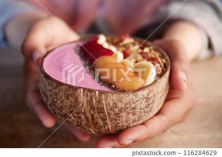 Indulge in a nutritious Smoothie Bowl with a variety of fresh fruits and nuts for a healthful boost 116284629