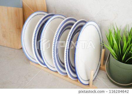 round bowl or ceramic plate on kitchen table. 116284642