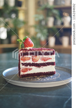 Strawberry chiffon cake on a plate against cafe background Strawberry chiffon cake on a plate against cafe background 116284692