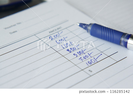 A man writes payment due in a paper form  116285142
