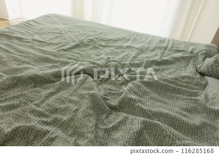 messy bed in early morning , messy bed after waking up messy bed in early morning , messy bed after waking up 116285168
