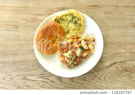 baking crispy butter croissant French bread butter garlic with macaroni dressing fried chop pork and slice tomato in ketchup sauce on plate baking crispy butter croissant French bread butter garlic with macaroni dressing fried chop pork and slice tomato in ketchup sauce on plate 116287787