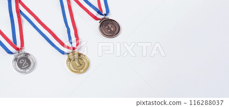 Gold silver and bronze demonstration trophy medals with ribbon for school university or national or olympic sport even organization competition. Isolated on white background. Award and victory concept 116288037