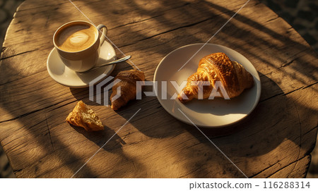Morning Coffee and Croissants on a Sunny Wooden Table Morning Coffee and Croissants on a Sunny Wooden Table 116288314