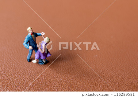 Couple dancing on a smooth brown background 116289581