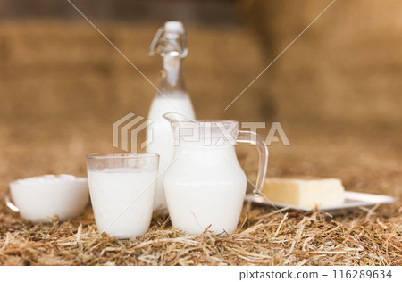 Dairy products on table against the background of hay 116289634