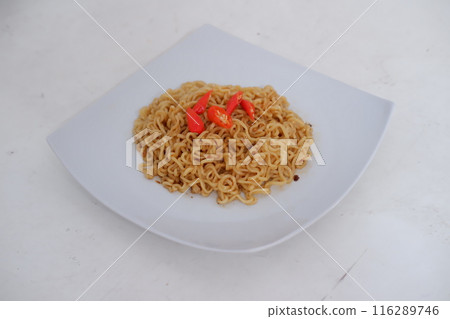 fried noodles on a plate 116289746