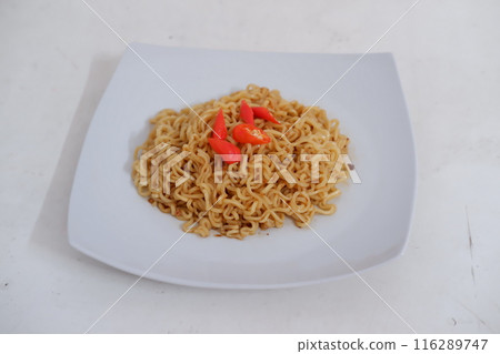 fried noodles on a plate 116289747