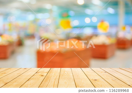 Empty wood table top with supermarket blurred background for product display Empty wood table top with supermarket blurred background for product display 116289968