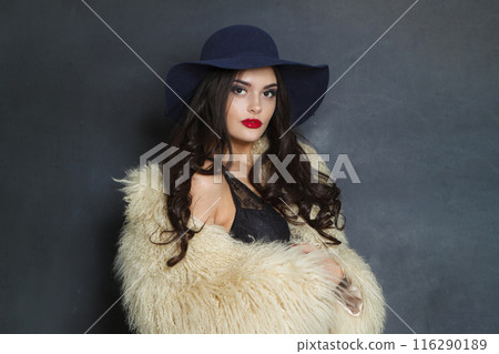 Glorious fashion model woman with long dark wavy hairstyle and red lips make-up Glorious fashion model woman with long dark wavy hairstyle and red lips make-up 116290189