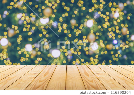 Empty wood table top with blur Christmas tree with bokeh light background 116290204