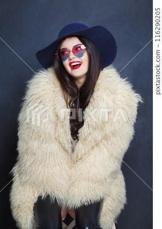 Laughing fashion model woman with long dark wavy hairstyle and red lips make-up  116290205